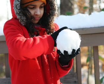 Close-up of young woman in snow
