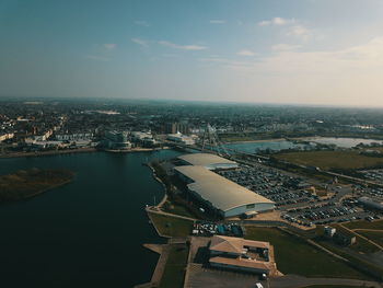 High angle view of buildings by sea against sky