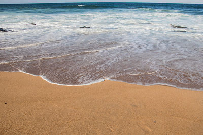 Scenic view of beach against sky