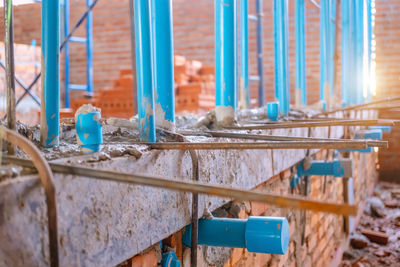 Close-up of metal railing against building