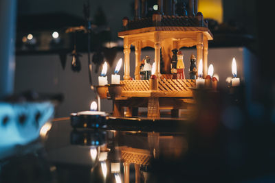 Illuminated tea light candles in restaurant