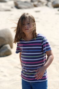 Rear view of girl standing on beach