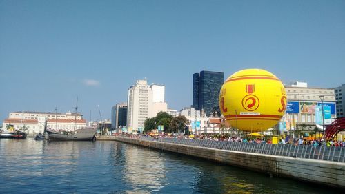 Panoramic shot of cityscape against clear blue sky