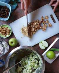 High angle view of person preparing food on table