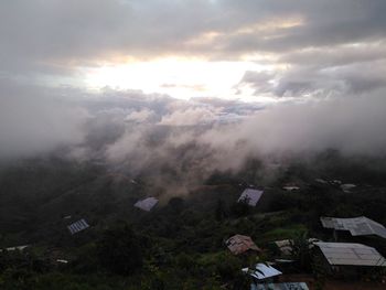 High angle view of houses and buildings against sky