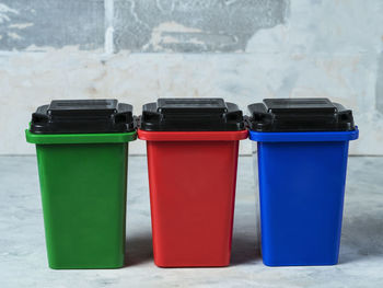 Green, red, blue dumpsters. garbage sorting concept