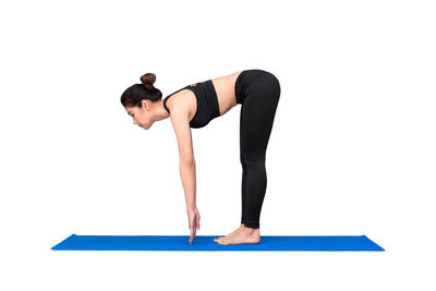 Low angle view of woman against white background