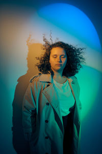 Young woman portrait, on colorful background