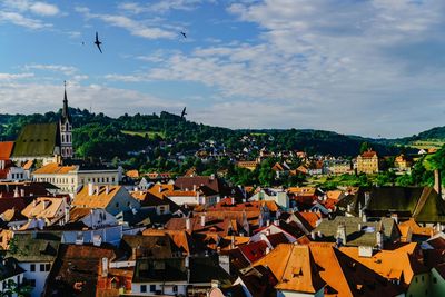 Houses in city against sky