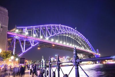 Illuminated ferris wheel at night