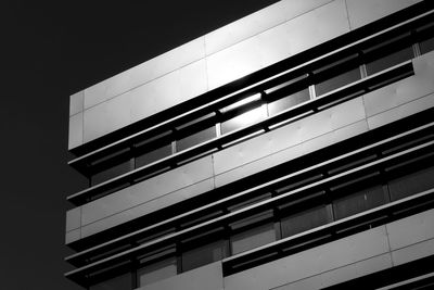 Low angle view of building against clear sky at night