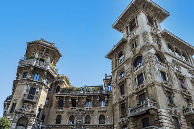 Low angle view of historical building against blue sky