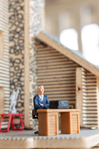 Man sitting on table in building