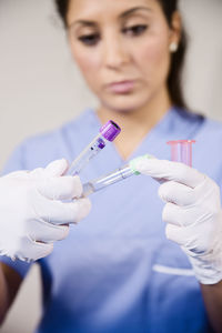 Nurse holding test tubes