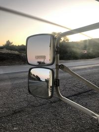 Reflection on side-view mirror of car