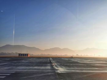 Road by sea against sky