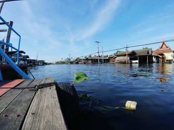 Boats in water against blue sky