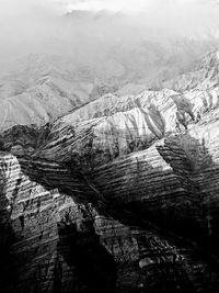 Aerial view of snowcapped mountains against sky