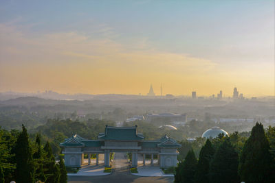 High angle view of buildings against sky during sunset