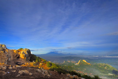 Scenic view of landscape against blue sky