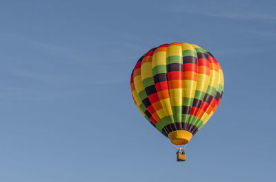 Low angle view of hot air balloon flying in sky