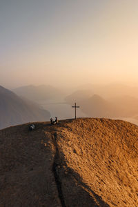 Scenic view of desert against sky during sunset