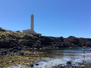 View of building against clear blue sky