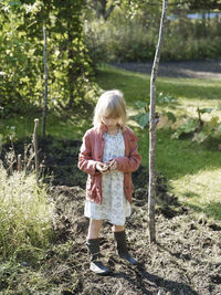 Girl standing in garden