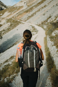 Backpacker walking on cares trail at picos de europe national park, asturias, spain