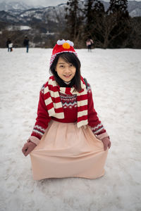 Portrait of a smiling girl in snow
