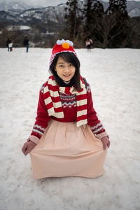 Portrait of young woman on snow