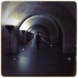 People walking in tunnel