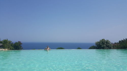 Scenic view of swimming pool against clear sky