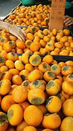 Close-up of oranges for sale at market stall