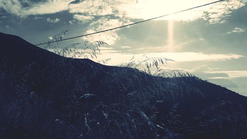 Scenic view of snowcapped mountains against sky during sunset