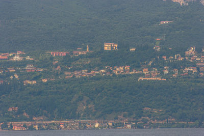 Aerial view of river amidst buildings in city