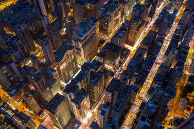 Aerial view of illuminated buildings in city at night