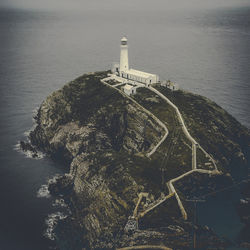 High angle view of lighthouse at seaside