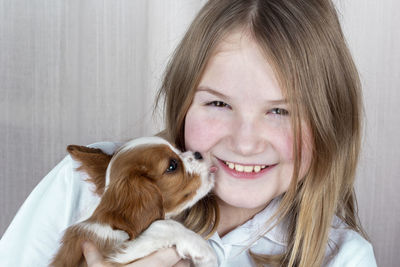 Portrait of cute girl with dog