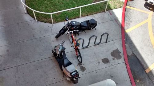 High angle view of bicycle on sidewalk