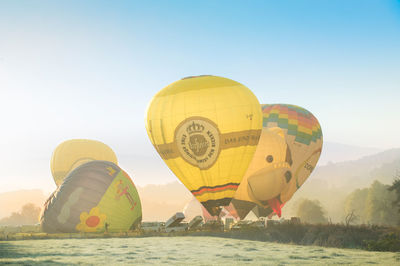 Hot air balloon flying over land