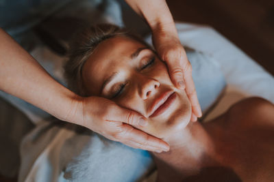 High angle view of man lying on hands