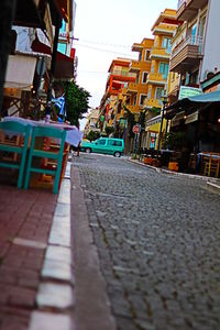 Street in city against sky