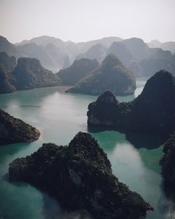 Scenic view of lake and mountains against sky