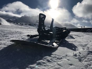 Boat on beach against sky during winter