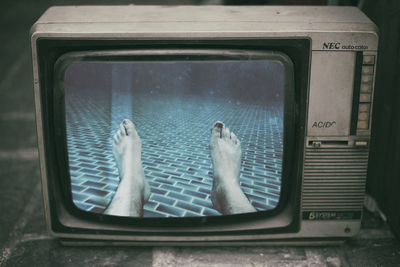 Close-up of legs in water