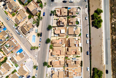 High angle view of street amidst buildings in town