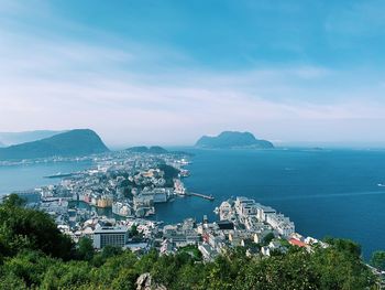 High angle view of sea and buildings against sky