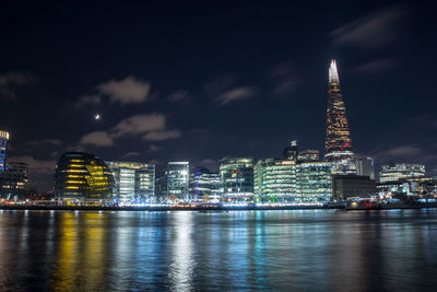 Illuminated buildings in city at night