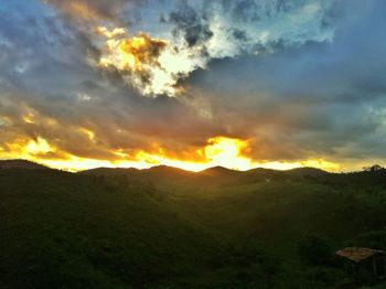 Scenic view of mountains against dramatic sky